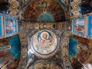 Low-angle photo of Sistine Chapel ceiling with Jesus Christ in the centre.