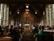 People seated in a church during a wedding mass.